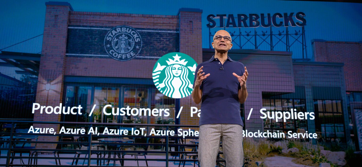 Keynote stage showing enterprise AI adoption